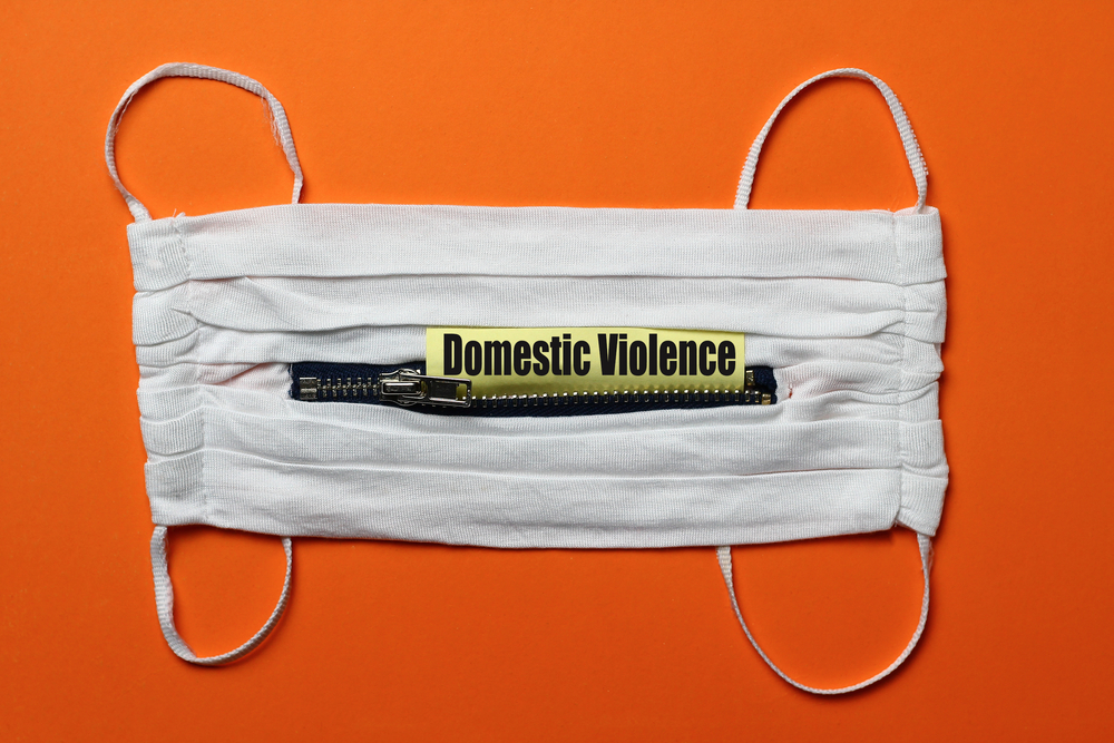 mask with text that says domestic violence