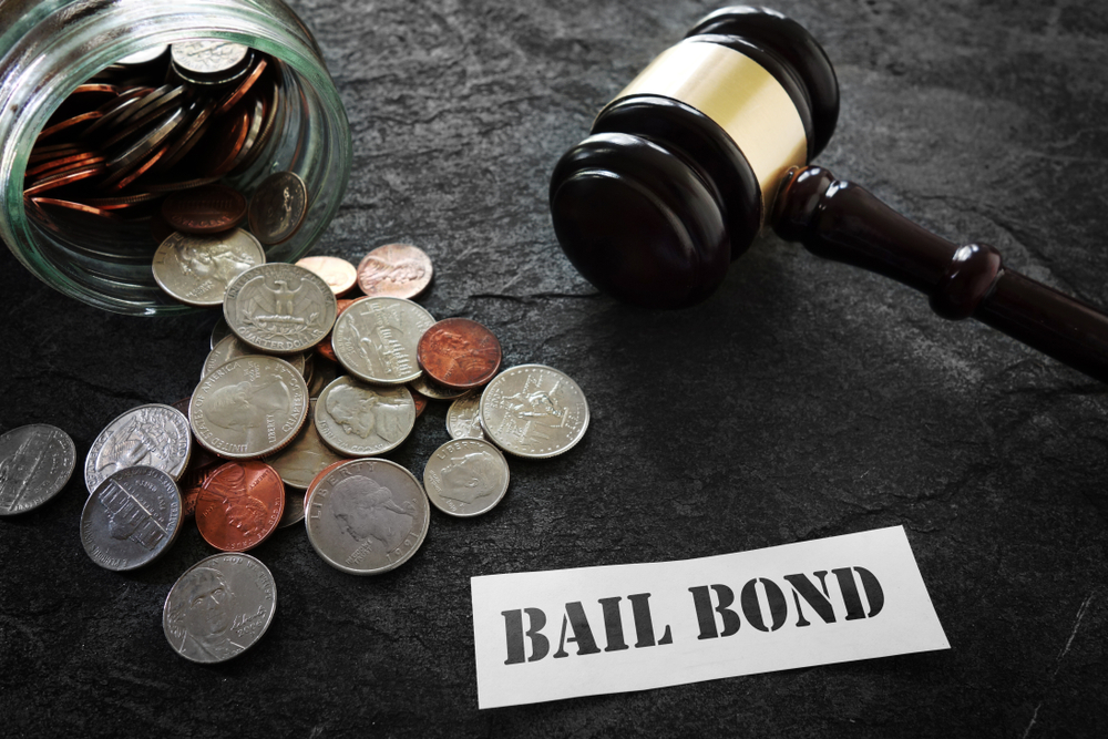 gavel with money and sign for bail bonds