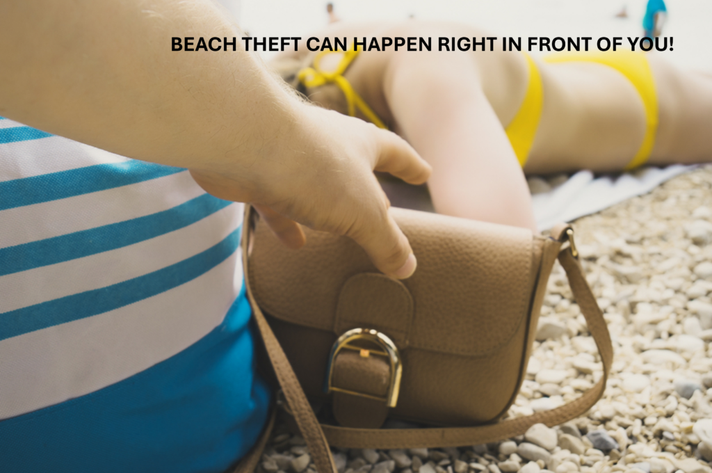 somebody stealing a purse on the beach