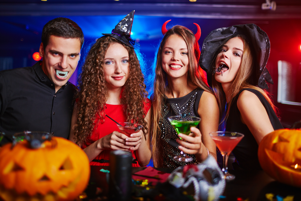 People in Halloween costumes drinking