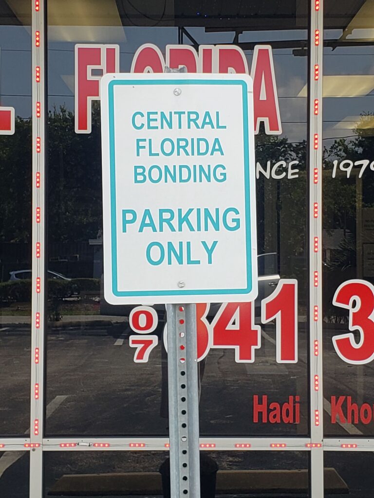 parking sign in front of Central Florida Bail Bonds office